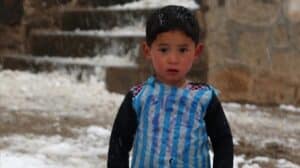 In this photograph taken on January 29  2016  Afghan boy and Lionel Messi fan Murtaza Ahmadi  5  wears a plastic bag jersey as he plays football in Jaghori district of Ghazni province   A five-year-old Afghan boy has become an internet star after pictures went viral of him wearing an Argentina football shirt made out of a plastic bag  complete with his hero Lionel Messi s name  AFP PHOTO